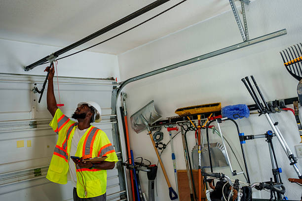 Professional Garage Door Panel Replacement technician working in Wellman, IA